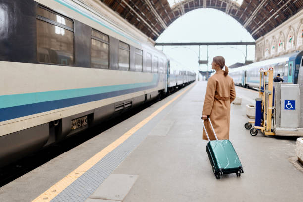 istock Woman walking at the railway station platform 1458602396