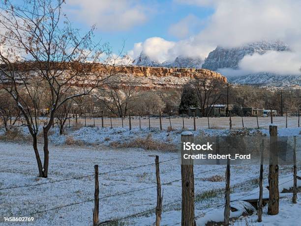 View Of The Snowcapped Mountains In Zion National Park In Winter As Seen Over Ranch Pastures Along The Virgin River In Rockville Utah Stock Photo - Download Image Now