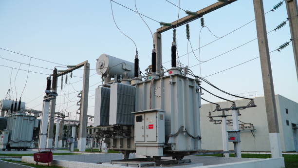 istock Power transformer. Electrical equipment. Electric substation. High voltage transformer against the blue sky. Electric current redistribution substation 1458602920
