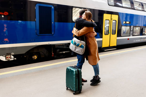 istock Couple parting at a train station. 1458607279