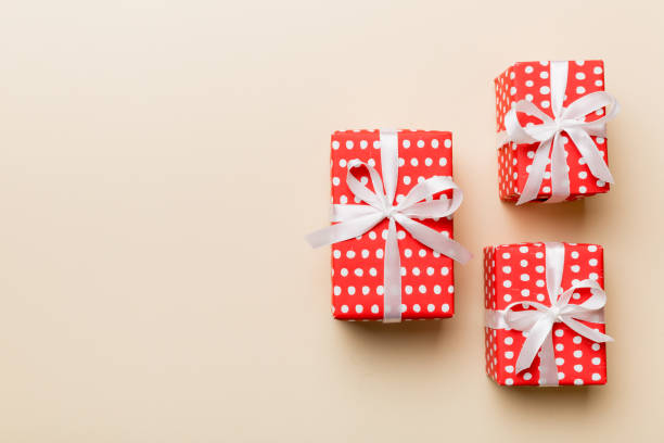 istock Valentine day composition: red gift box with bow and heart. Christmas present. View from above. Space for text. Holday greeting card 1458609295