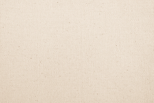 Muslin woven texture background light cream beige brown color