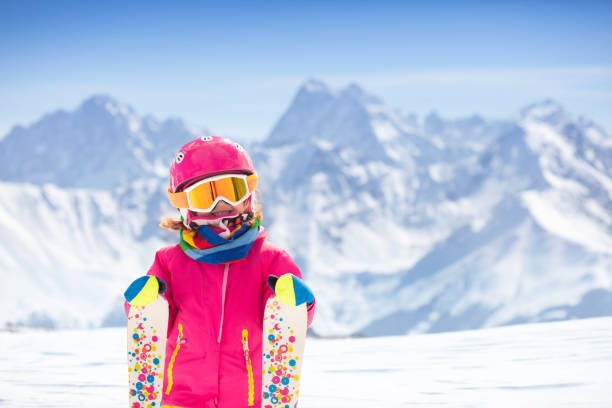 istock Ski and snow fun. Child in winter mountains. 1458612766