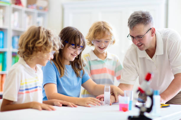 istock School science class. Students at chemistry lesson 1458614147