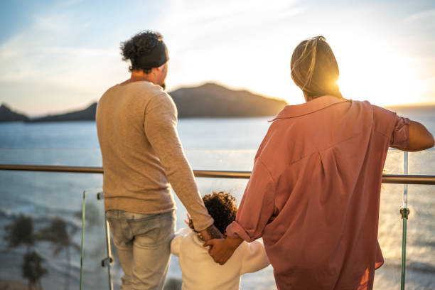 istock Family looking to the landscape at rooftop 1458617865