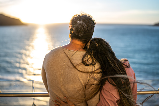 Couple looking to the landscape during a cruise travel