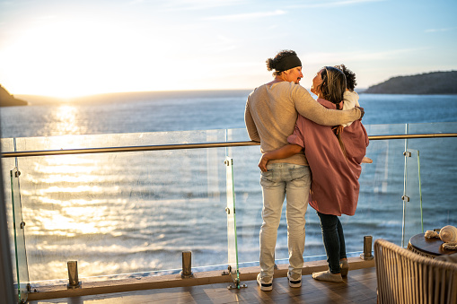 Family embraced during sunset at cruise travel