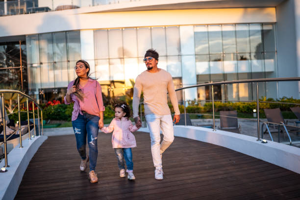 istock Family walking with holding hands at resort 1458618126