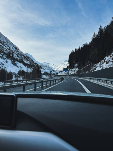 istock View of the snowy Alps from inside a car 1458618480