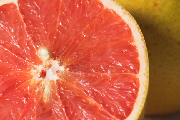 istock Close up of a Sliced Pink Grapefruit 1458628667