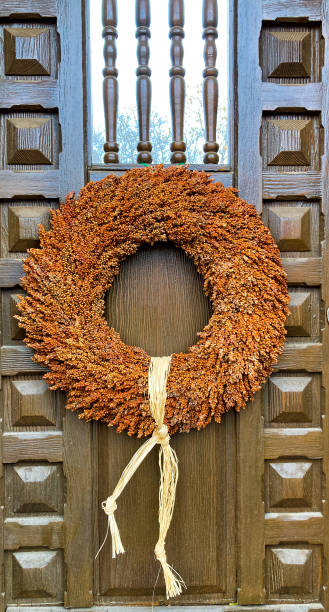 istock Santa Fe Style: Rustic Christmas Wreath, Antique Brown Door 1458632393