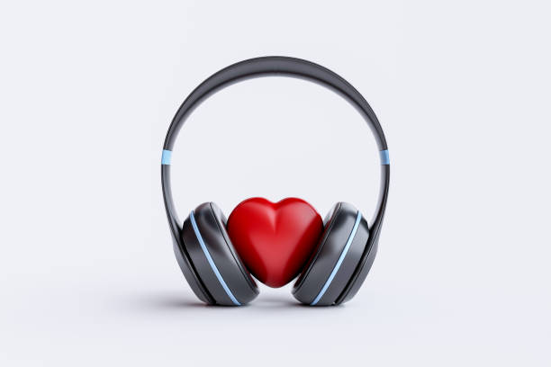 istock Wireless headphones with heart on white background 1458632723