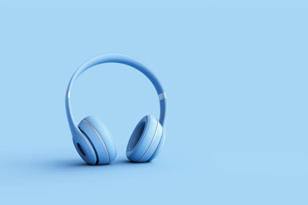 istock Wireless headphones on blue background 1458632728