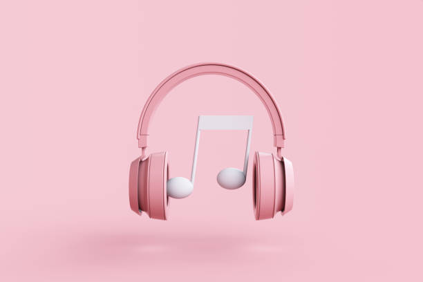 istock Wireless headphones with music note on pink background 1458633243