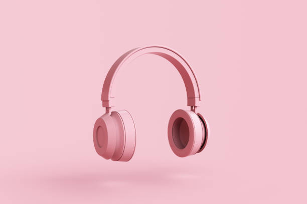 istock Wireless headphones on pink background 1458633244