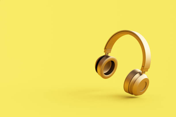 istock Wireless headphones on yellow background 1458633247