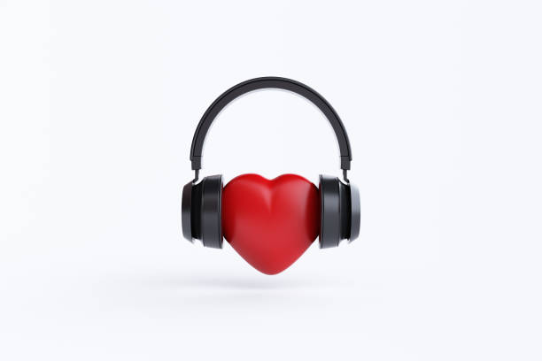 istock Wireless headphones with heart on white background 1458633250