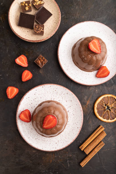 istock Chocolate jelly with strawberry on black concrete, top view. 1458633300