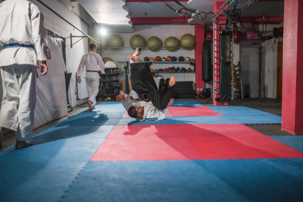 istock A small group of young fighters practice aikido falling skills 1458633910