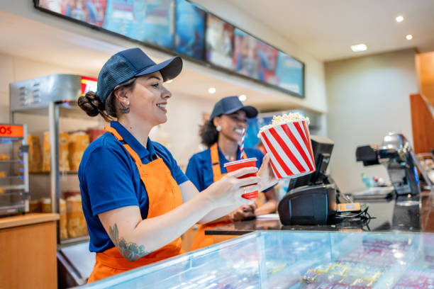 istock Attendant delivering popcorn and soda 1458634097