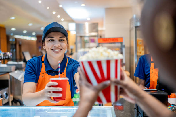 istock Attendant delivering popcorn and soda 1458635059