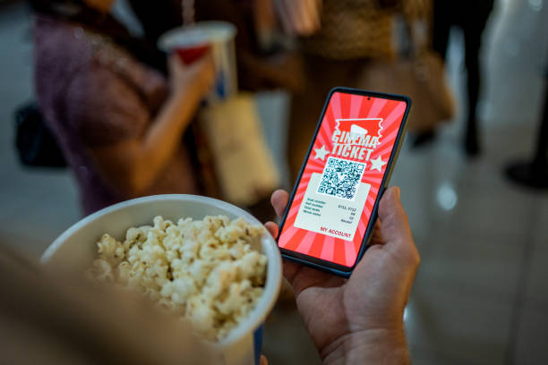 person using mobile app for cinema entrance - ticket movie theater movie movie ticket imagens e fotografias de stock