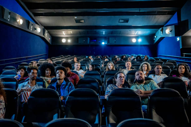 istock People watching movie in cinema 1458636474