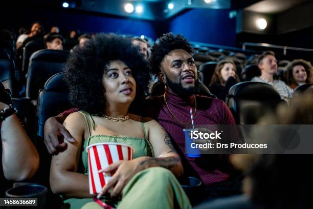 Black Couple Smiling At The Cinema Stock Photo - Download Image Now - Movie Theater, Movie, Film Industry