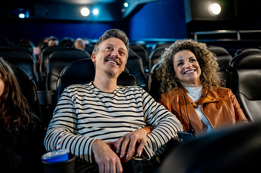 Couple watching movie in cinema