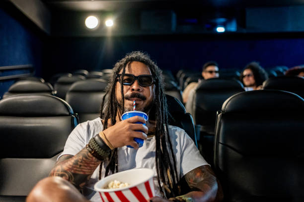 istock Man with 3D glasses at the cinema 1458636911
