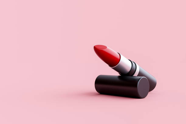 istock Red lipstick close-up on pink background 1458639388
