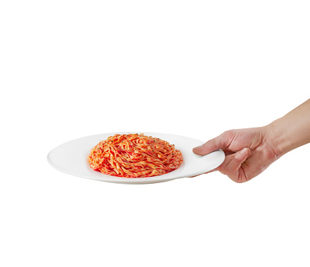 Waiter serving pasta with tomato sauce