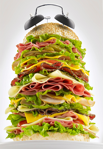 Alarm bells on top of a huge sandwich