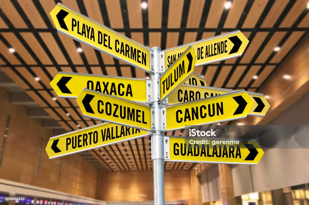 Mexican city signs Signs pointing Mexican touristic cities in an airport terminal Acute Angle Stock Photo