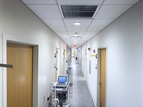 Illuminated corridor at modern hospital