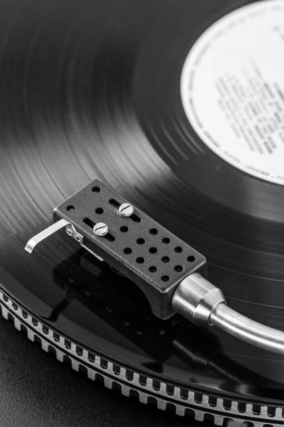 istock black vinyl record spinning on a vintage stereo turntable 1458646207