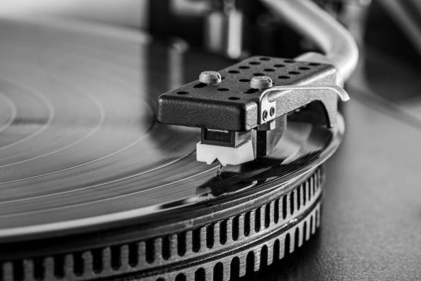 analog stereo turntable vinyl record player. closeup view. monochrome.