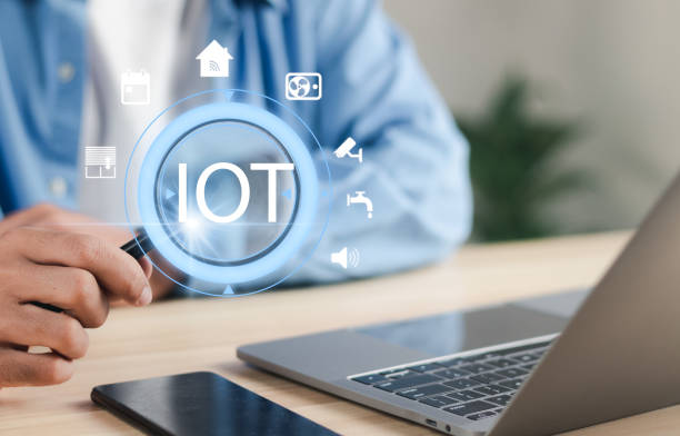 istock Businessman working with PC laptop using magnifying glass at IOT on virtual screen interface. Wireless network technology equipment. Intelligent digital management control process. 1458649695