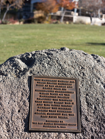 Los Alamos, NM: A memorial sign in downtown Los Alamos, where the atomic bomb was developed under the aegis of the Manhattan Project in the 1940s.