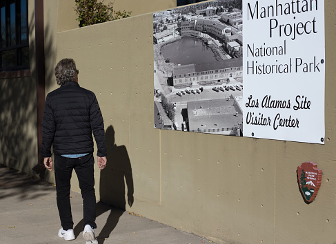 Los Alamos, NM: A tourist at the Manhattan Project Visitor’s Center in downtown Los Alamos, where the atomic bomb was developed under the aegis of the Manhattan Project in the 1940s.