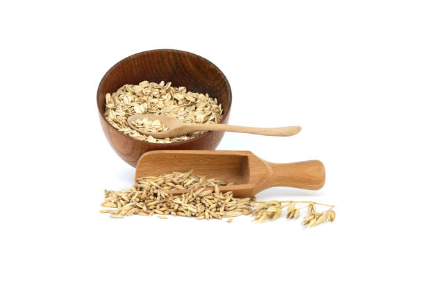 istock Oats with husks and oat groats rolled into flakes 1458651600