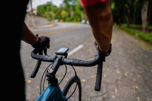 istock Closeup of cyclist with hands on handlebars 1458652735