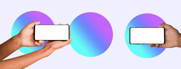 istock Man hand holding the black smartphone blank screen with modern frameless design, two positions vertical and rotated - isolated on white background 1458654167