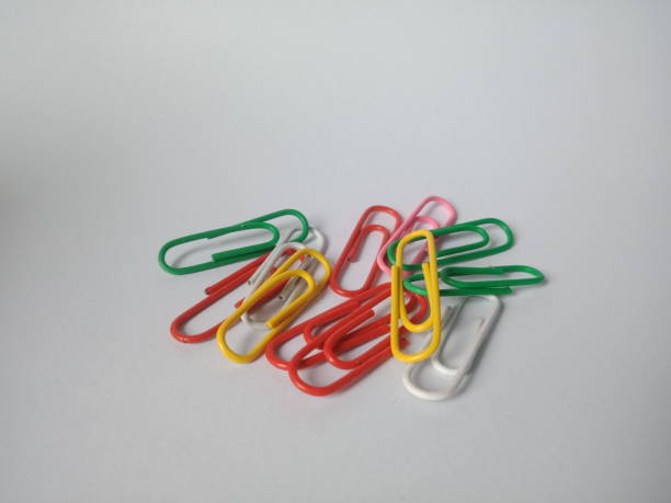istock colorful paper clips. White Isolated background. 1458657665