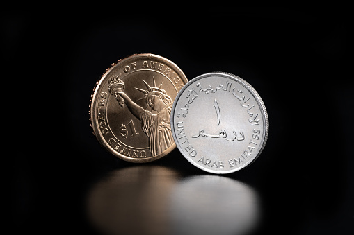 A close-up of Polish Zloty coins on a black background on a black background