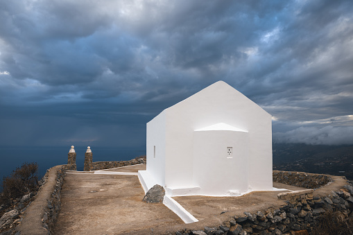 White Timios Stavros church on top of the mountain above Plakias, Crete.