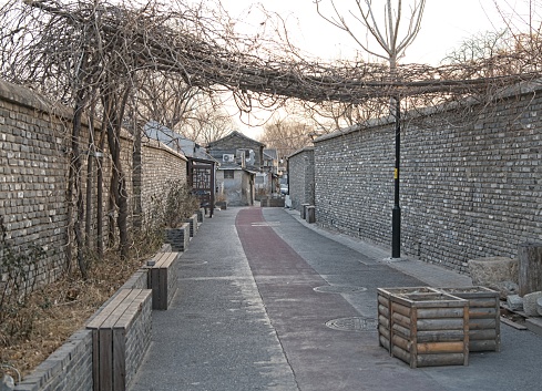Old hutong (alley) at city centre of Beijing. Hutongs are mostly narrow alley inside residential areas at a city centre of Beijing.