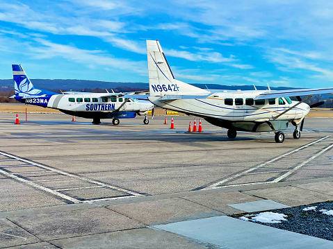 Morgantown, West Virginia, USA - January 16, 2023: Two Southern Airways Express Cessna 208 Caravan aircraft prepare to taxi for take-off outside the passenger terminal at Morgantown Municipal Airport’s Walter J. Hart Field.