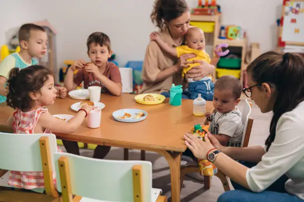 children have breakfast in kindergarten