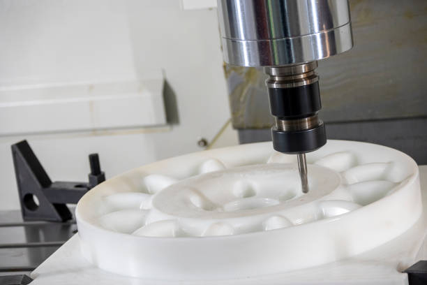 istock The  CNC milling machine cutting the nylon 6 material part with ball end mill tool. 1458681237